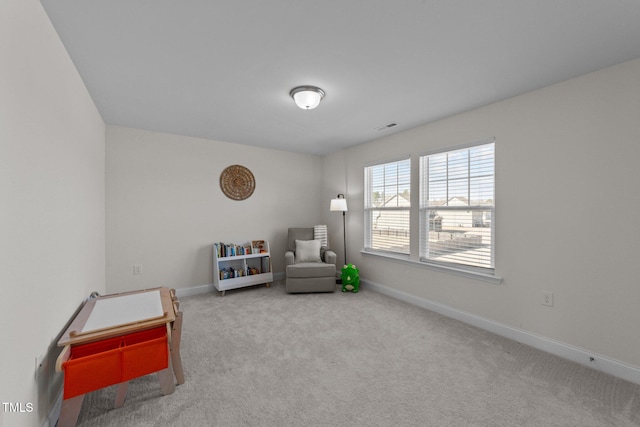 sitting room featuring carpet, visible vents, and baseboards