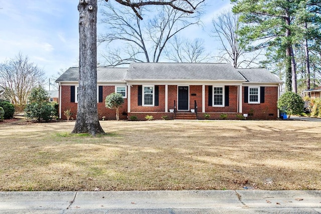 ranch-style house featuring a front lawn, crawl space, and brick siding