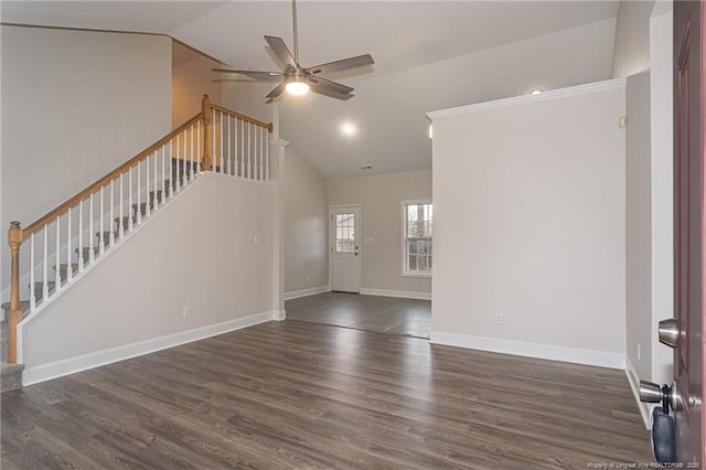 unfurnished living room with a ceiling fan, baseboards, stairway, and wood finished floors