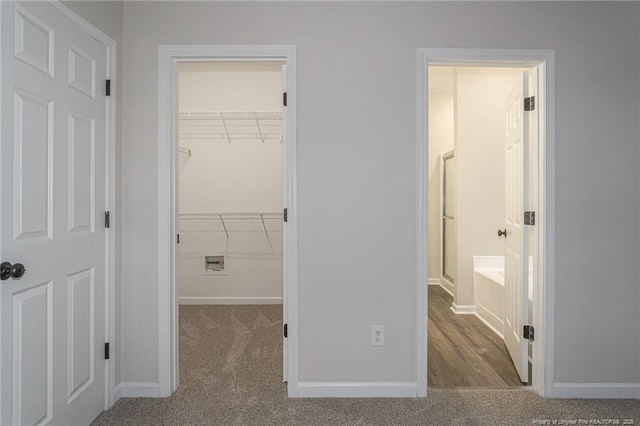 interior space featuring carpet floors and baseboards