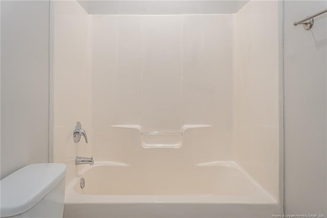 full bath featuring toilet and shower / bathing tub combination