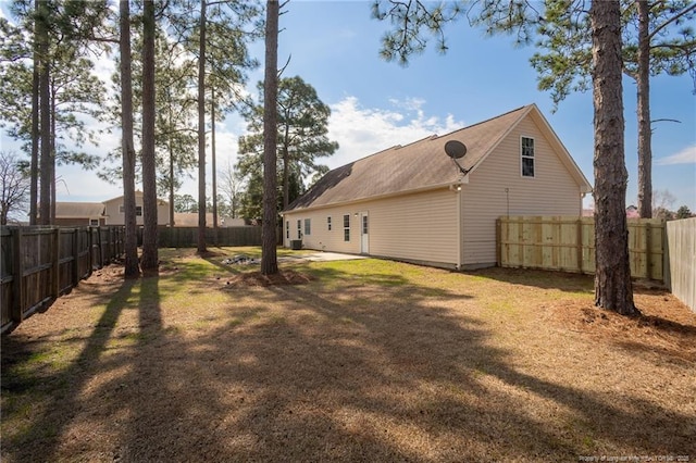 view of yard featuring a patio area and a fenced backyard