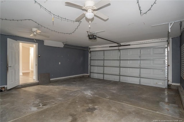 garage with ceiling fan, baseboards, and a garage door opener