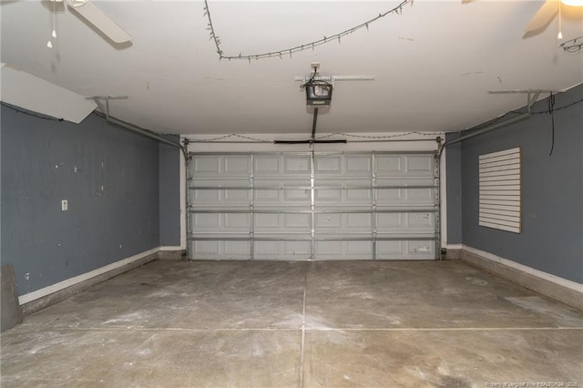 garage with ceiling fan, baseboards, and a garage door opener