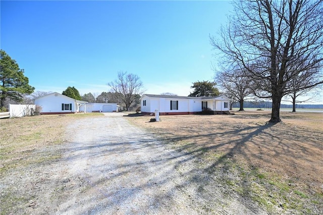 view of front of property featuring fence