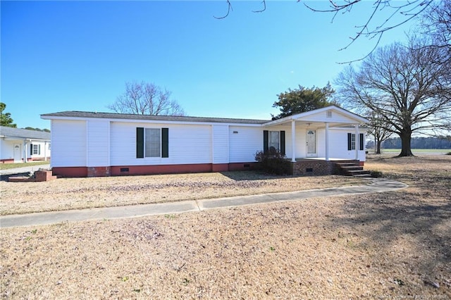 view of front facade with crawl space and a porch