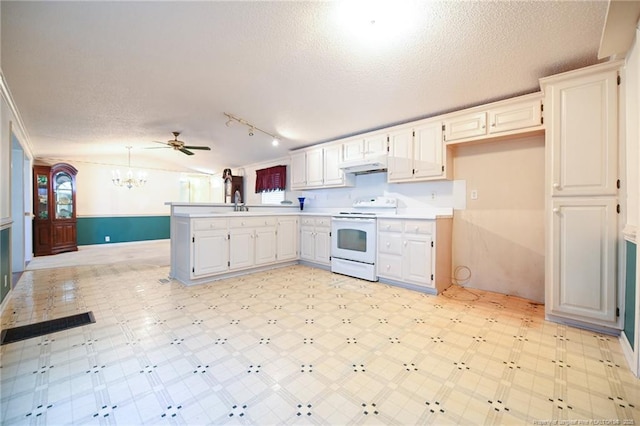 kitchen featuring electric stove, a peninsula, under cabinet range hood, a textured ceiling, and light floors