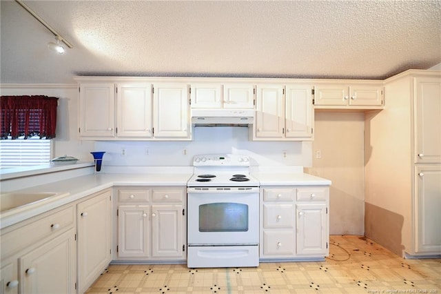 kitchen featuring under cabinet range hood, electric range, a textured ceiling, and light floors