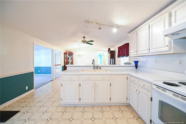 kitchen with white electric stove, white cabinets, a peninsula, light floors, and a sink