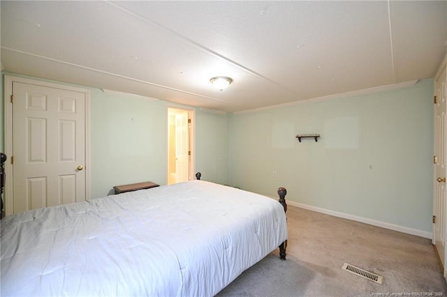 bedroom featuring carpet, visible vents, and baseboards