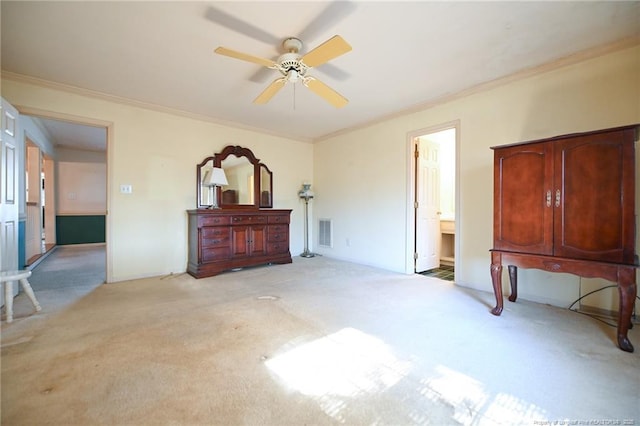 bedroom with ornamental molding, visible vents, and light colored carpet