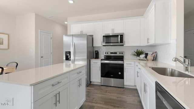 150 Ethel Ln, Angier, NC 27501 - kitchen featuring stainless steel appliances, a sink, recessed lighting, tasteful backsplash, and light countertops