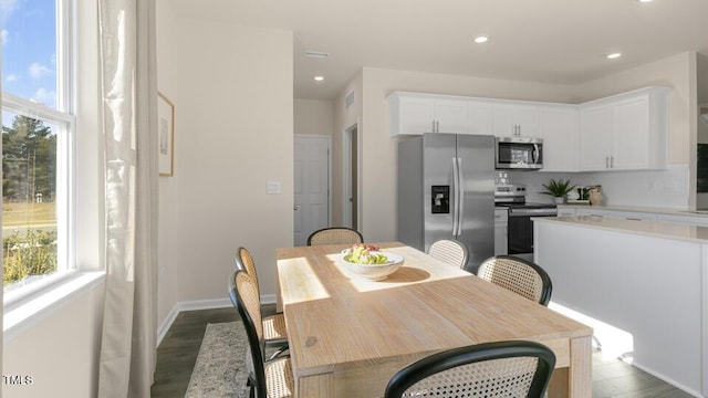 150 Ethel Ln, Angier, NC 27501 - dining area with dark wood finished floors, recessed lighting, and baseboards