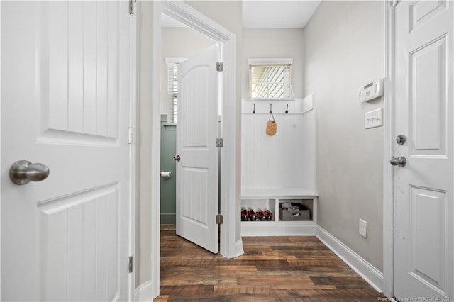 mudroom featuring dark wood-style floors and baseboards