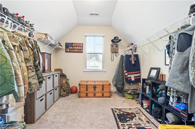 spacious closet featuring vaulted ceiling, carpet, and visible vents