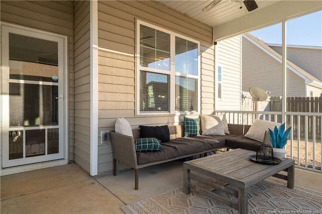 view of patio with outdoor lounge area, ceiling fan, and fence