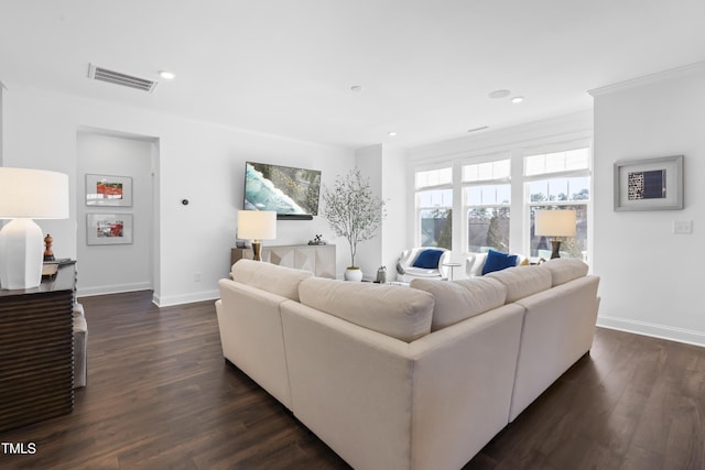 living room featuring baseboards, visible vents, ornamental molding, dark wood-style flooring, and recessed lighting