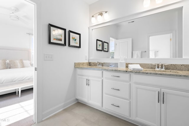 ensuite bathroom with double vanity, visible vents, a sink, and ensuite bathroom