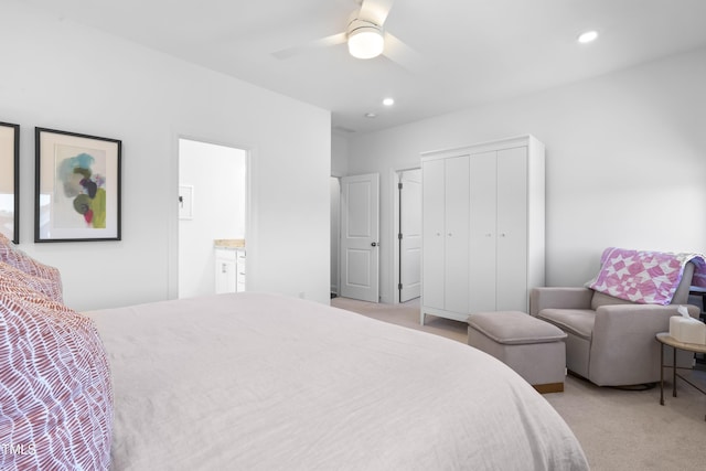 bedroom featuring recessed lighting, a closet, light colored carpet, and ceiling fan