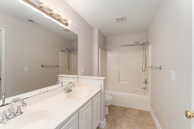 bathroom featuring toilet, visible vents, and a sink