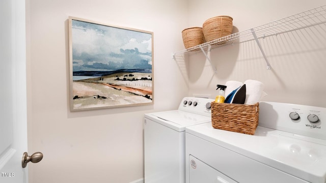 laundry room featuring laundry area and separate washer and dryer