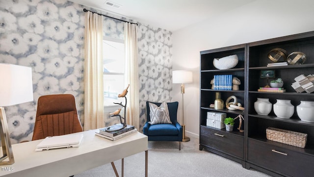 office space featuring visible vents, light carpet, and wallpapered walls