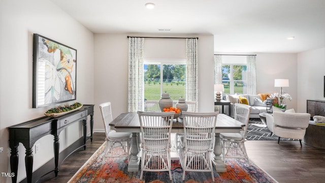 dining area featuring visible vents and wood finished floors