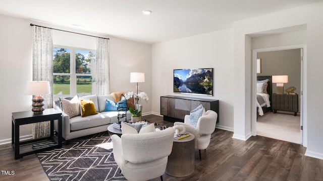 living room featuring dark wood finished floors and baseboards