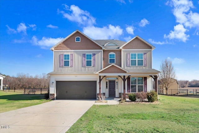 craftsman-style home featuring covered porch, concrete driveway, an attached garage, fence, and a front lawn