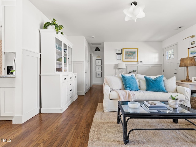 living area featuring dark wood-type flooring