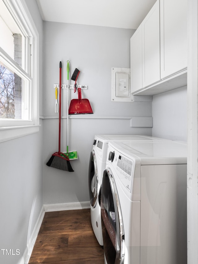 laundry area with cabinet space, baseboards, dark wood-type flooring, and independent washer and dryer