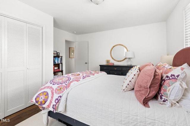 bedroom featuring a closet and wood finished floors