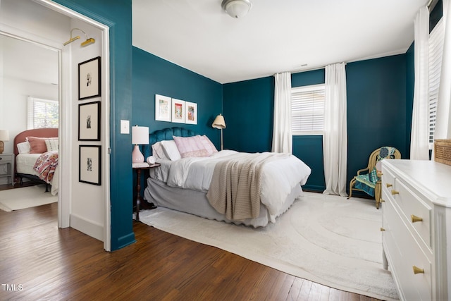 bedroom with wood finished floors