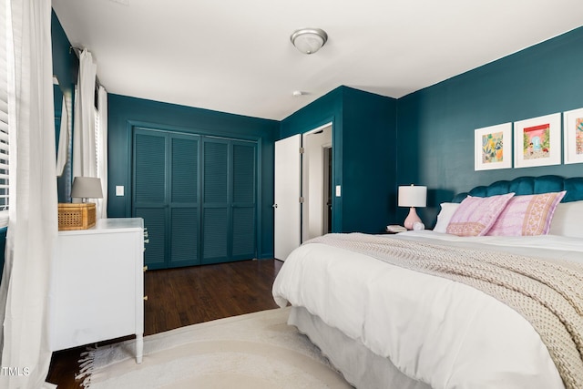 bedroom featuring a closet and wood finished floors