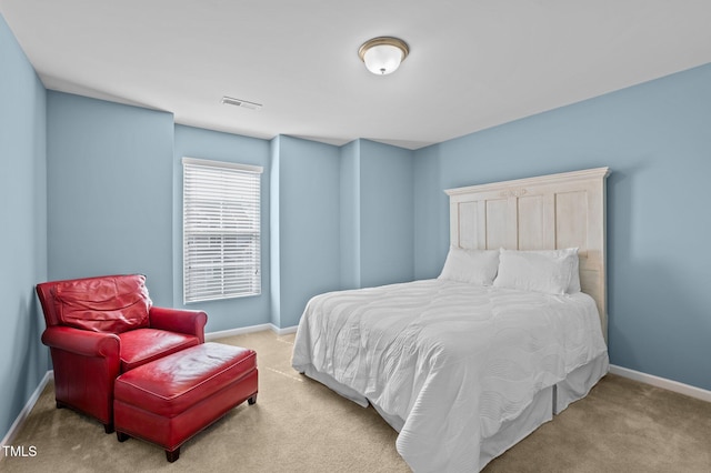 carpeted bedroom with baseboards and visible vents