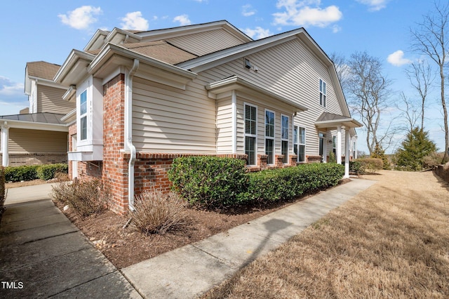 view of home's exterior featuring brick siding