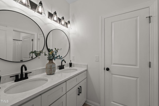 bathroom with double vanity and a sink