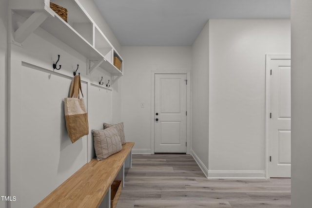 mudroom with baseboards and light wood finished floors