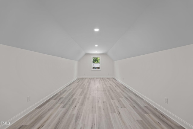 bonus room featuring lofted ceiling, recessed lighting, baseboards, and light wood-style floors