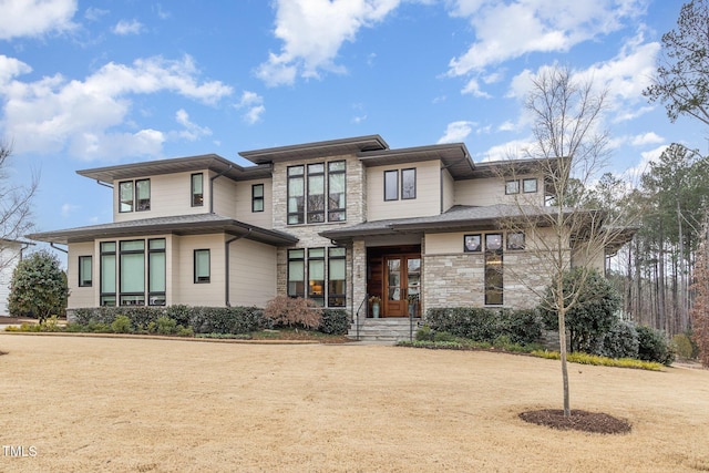 prairie-style home with stone siding