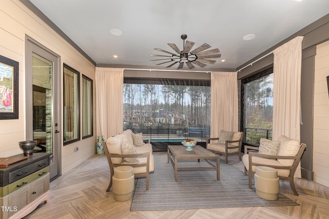 sitting room with a ceiling fan and recessed lighting