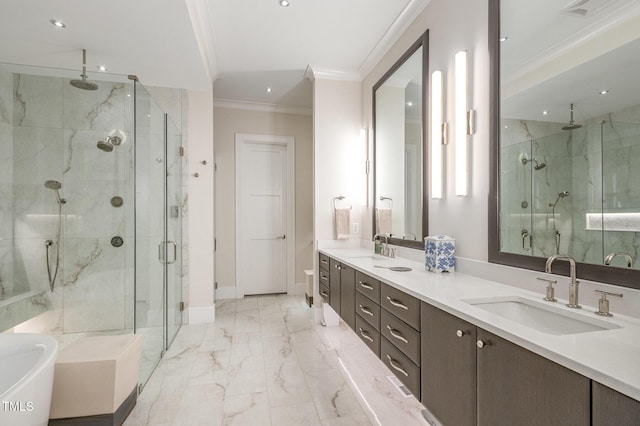 full bath with baseboards, marble finish floor, crown molding, a shower stall, and a sink