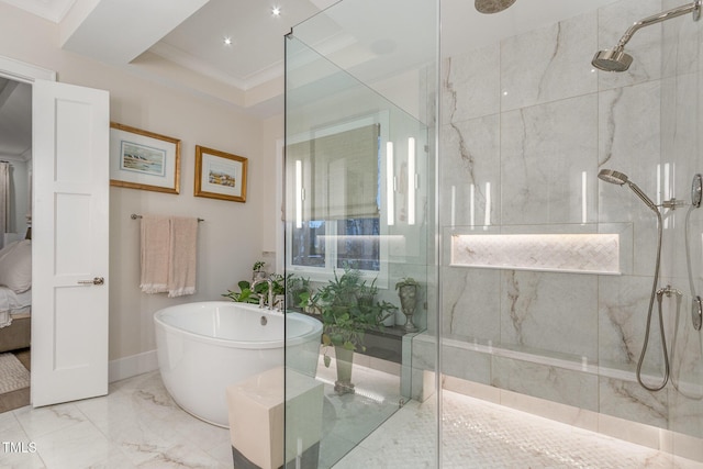 full bath with marble finish floor, a marble finish shower, a soaking tub, ornamental molding, and ensuite bath