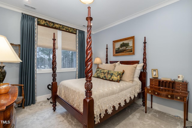 carpeted bedroom featuring visible vents, ornamental molding, and baseboards