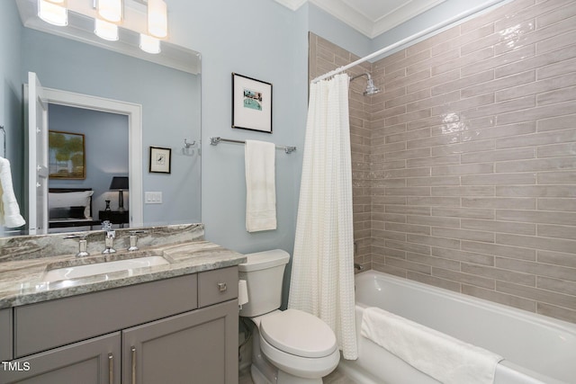 ensuite bathroom featuring shower / tub combo with curtain, toilet, ornamental molding, vanity, and ensuite bath