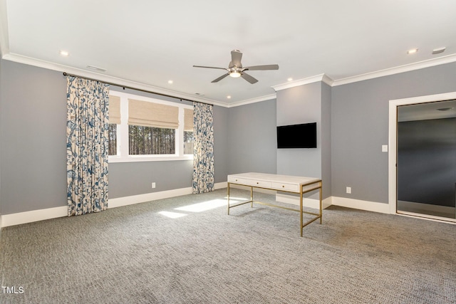 interior space featuring baseboards, carpet flooring, a ceiling fan, and crown molding