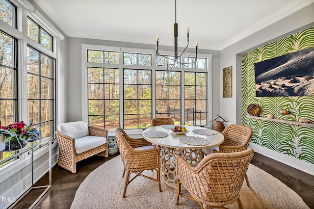 sunroom with a chandelier