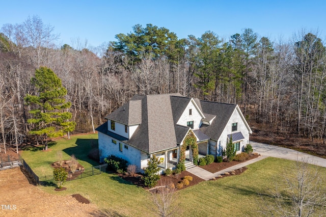 bird's eye view featuring a wooded view