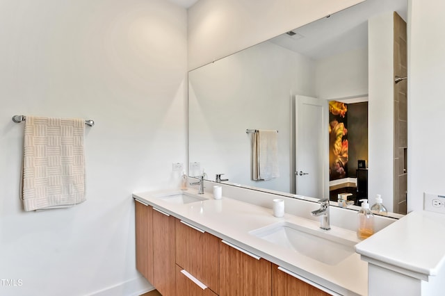 bathroom featuring double vanity and a sink