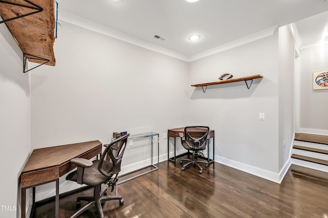 office area featuring baseboards, wood finished floors, visible vents, and crown molding